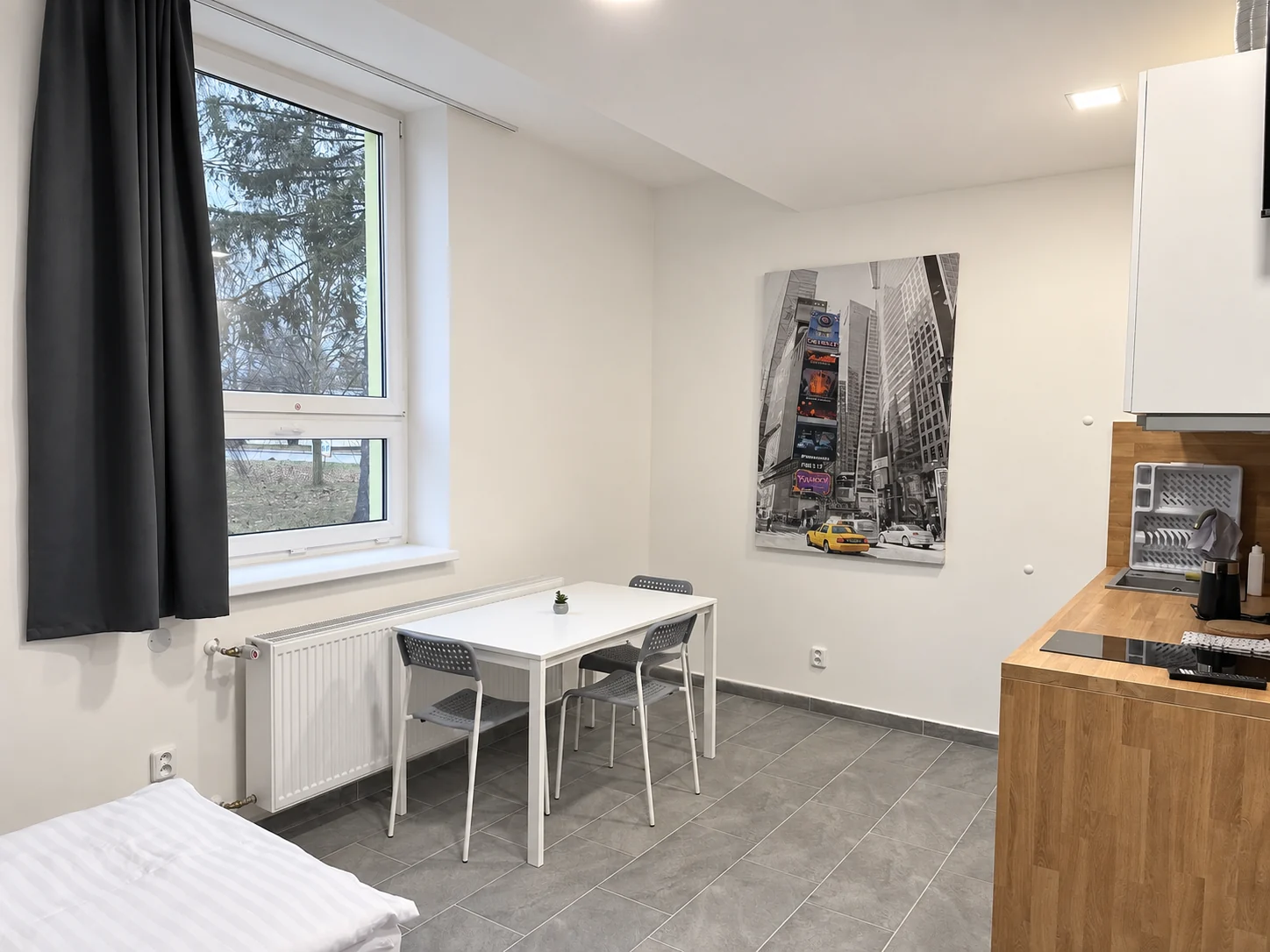 Třílůžkový pokoj · s kuchyňským koutem